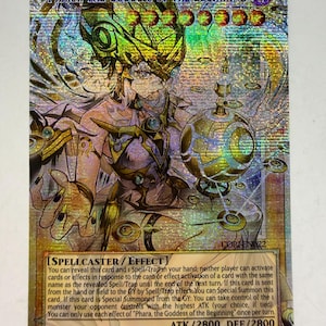 May include: A holographic trading card featuring "Phara, the Goddess of the Beginning." The card has a detailed illustration of a female figure with gold and purple accents. The card text includes "Spellcaster/Effect" and ATK/2800 DEF/2800.