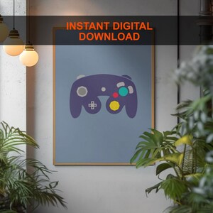 Puede incluir: Una descarga digital instantánea de un póster imprimible con un mando de GameCube morado sobre un fondo azul claro. El póster tiene el texto "INSTANT DIGITAL DOWNLOAD" en la parte superior.