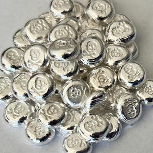 50 barras de calavera pirata de plata fina de 1 gramo.