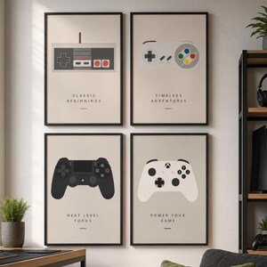 May include: A set of four framed wall art prints featuring minimalist illustrations of video game controllers. Each print displays a different controller design with the text Classic Beginnings, Timeless Adventures, Next Level Focus, and Power Your Game.