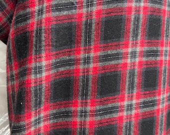 May include: Red and black plaid flannel fabric with a subtle gray thread woven into the pattern.