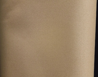 May include: A roll of brown fabric with a textured weave.