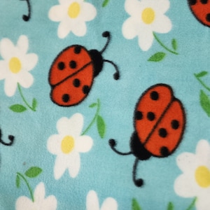 Red Lady Bug on blue Anti pill, Fleece Fabric floral print  Fleece Polar By The Yard 60&quot; Wide