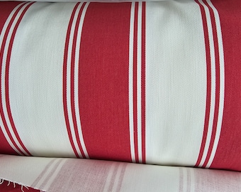May include: Red and white striped fabric with a thick, horizontal stripe pattern. The fabric is folded in half, showing the reverse side.