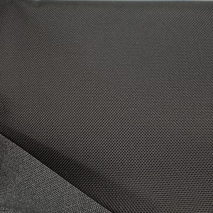 May include: Close-up of a dark gray fabric with a textured weave. The fabric has a subtle sheen and a smooth, even surface.