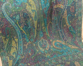 May include: A teal, green, and purple paisley patterned shawl with a fringed edge.