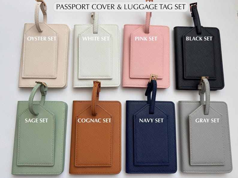 May include: A collection of passport covers and luggage tag sets in various colors, including oyster, white, pink, black, sage, cognac, navy, and gray. Each set includes a passport cover and a matching luggage tag.