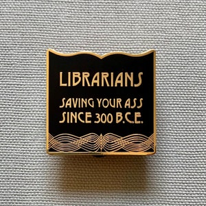 Librarians Saving Your Ass Book Shaped Hard Enamel Pin Gold and Black Deco Style for Librarians and Library Lovers