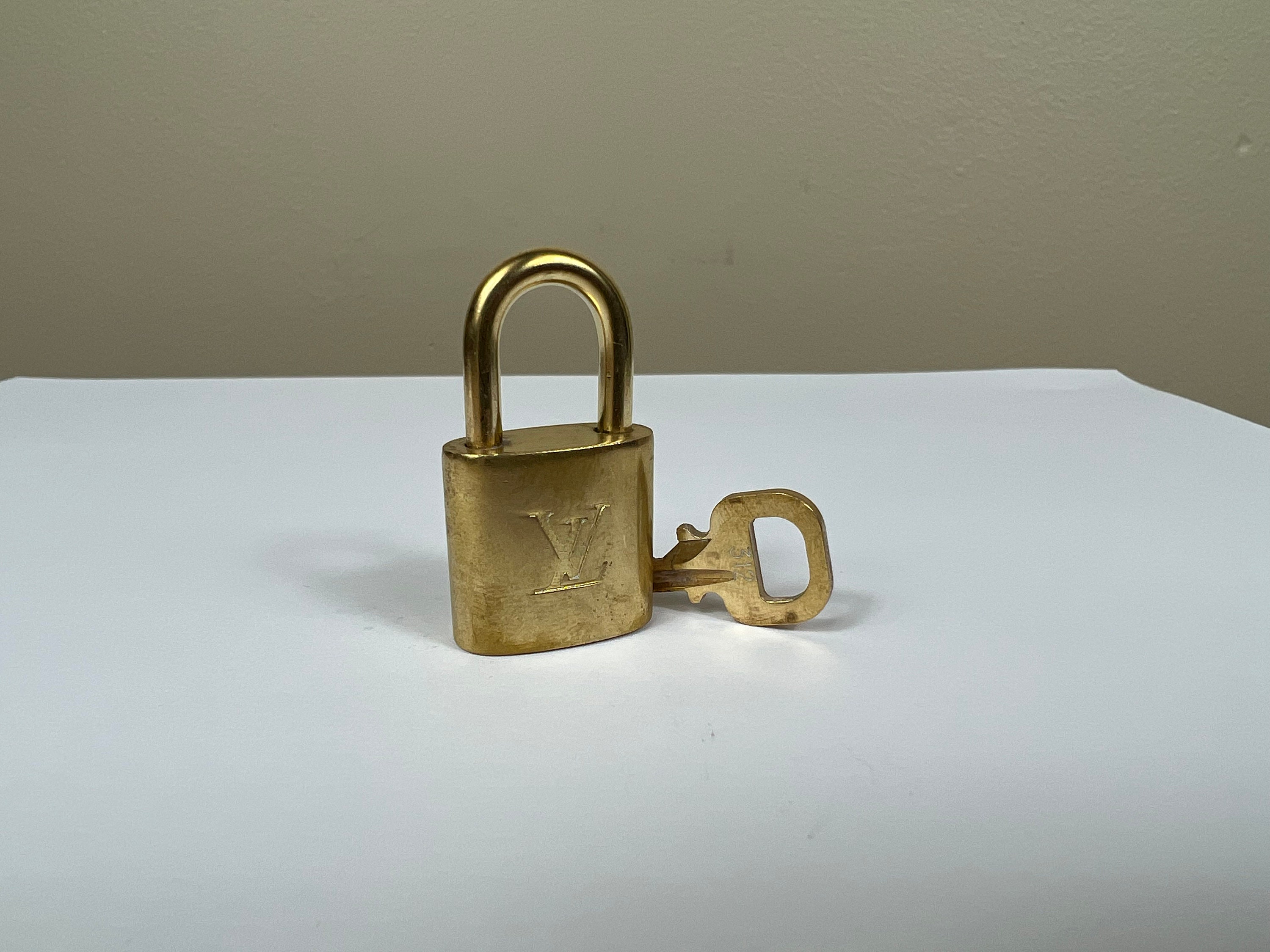 Louis Vuitton Gold/Brass, Metal LV' logo padlock and key #323 in 2023