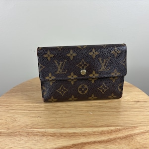 Auténtica cartera Louis Vuitton Monogram Porte Trésor International de tres pliegues