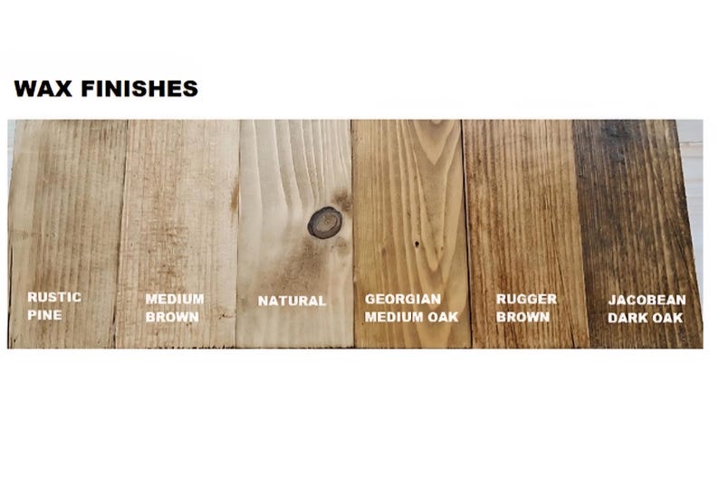 May include: A display of six wood samples labeled WAX FINISHES, showing different stains: Rustic Pine, Medium Brown, Natural, Georgian Medium Oak, Rugger Brown, and Jacobean Dark Oak. Each vertical wood plank displays a unique grain pattern.