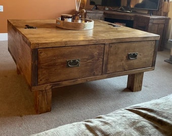 Hand made coffee table with storage and 4" wooden square legs. Bespoke sizes available.