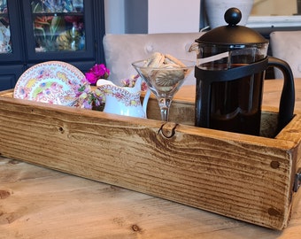 Rustic wooden tray in waxed finish with handles.