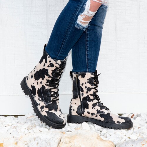 black cow print booties