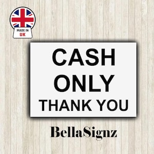 May include: A white rectangular sign with the text "CASH ONLY THANK YOU" in bold black lettering. The sign features a "Made in UK" emblem with the Union Jack. The sign is branded with "BellaSignz".