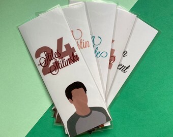 May include: A set of six bookmarks featuring different characters from the TV show "Teen Wolf". The bookmarks are printed on white cardstock and feature a variety of colors and designs. The bookmarks are all approximately 6 inches long and 2 inches wide.
