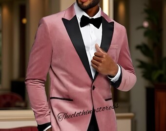 May include: A dusty rose velvet blazer with black satin lapels and trim. The blazer is paired with a white dress shirt and a black bow tie. The text "Theclothingstoress" is visible on the blazer.