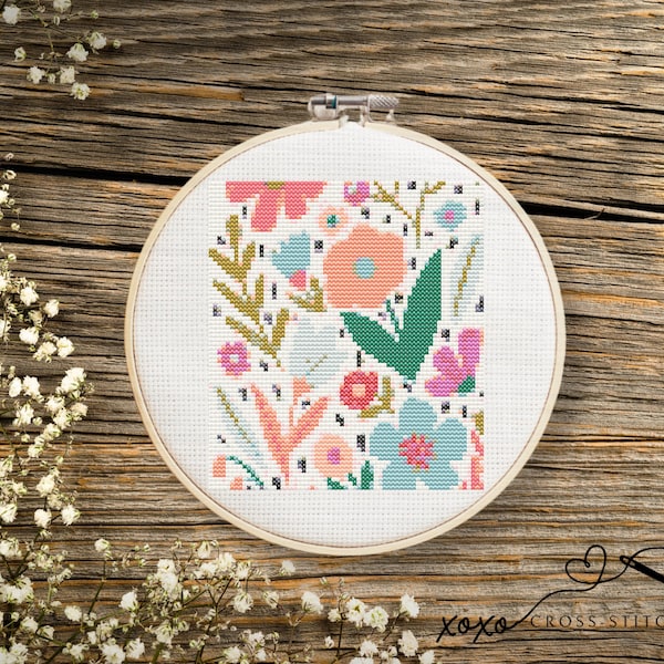 Patrón de punto de cruz con motivos florales modernos