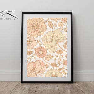 May include: A framed print with a vintage floral pattern in shades of peach and cream. The flowers are outlined in brown and have a delicate, hand-drawn style.
