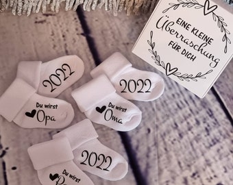 1 or 2 baby socks personalized in white for pregnancy announcement gift also available with 2 socks