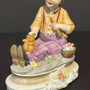 Vintage Napcoware Porcelain Figurine Little Boy Feeding a Squirrel Surrounded by Flowers