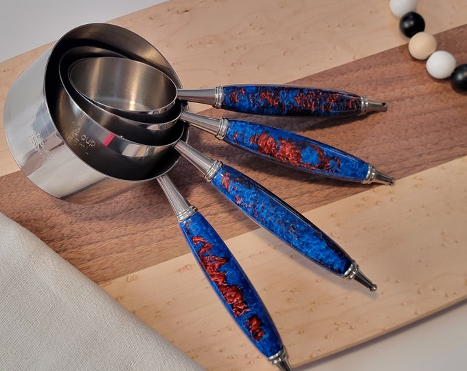 Handmade measuring cups, blue and red.