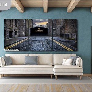 May include: A three-panel canvas print depicting a street scene in Dublin, Ireland. The central panel features a large, arched doorway with the words "The Guinness Storehouse" above it. The panels are 40x30 inches (101.6x76.2 cm).