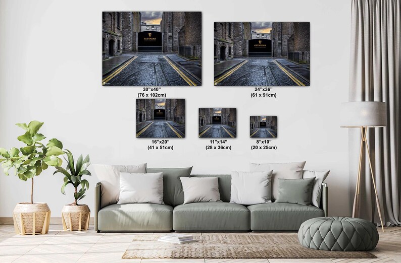 May include: A photo collage showing different sizes of a canvas print featuring a black and white photo of a narrow street with a stone archway and the words "Guinness" in gold lettering. The sizes are 30x40 inches, 24x36 inches, 16x20 inches, 11x14 inches, and 8x10 inches.