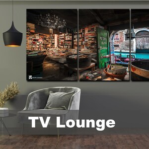 May include: A three-panel canvas print depicting a bookstore interior with shelves full of books, a wooden floor, and a view of a canal in Venice, Italy. The print is 40 inches by 90 inches.