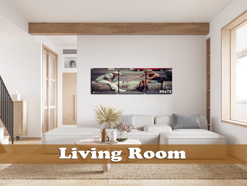 May include: A living room with a white couch and a brown wooden coffee table. A framed print of two people playing chess on a sidewalk is hanging on the wall. The print is divided into three sections and the text "24x72" is printed in the bottom right corner.
