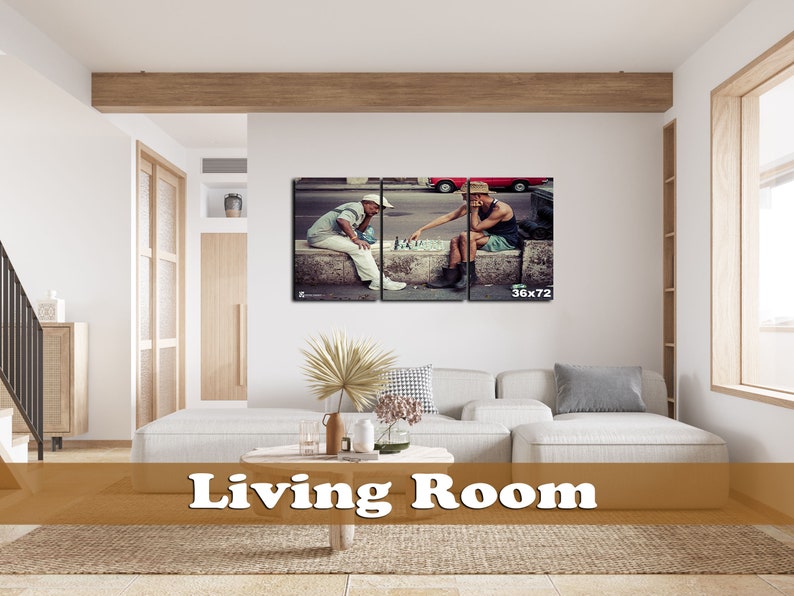 May include: A split canvas print of two men playing chess on a street in a city. The men are wearing casual clothing and are sitting on a concrete ledge. The print is in a living room setting with a couch and a coffee table.