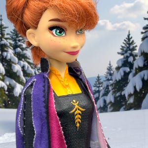 Close-up of Anna doll face showing green eyes, freckles, auburn hair, and soft smile
