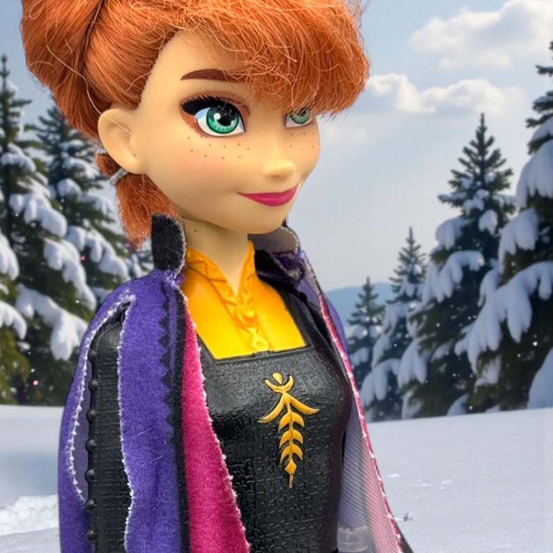 Close-up of Anna doll face showing green eyes, freckles, auburn hair, and soft smile