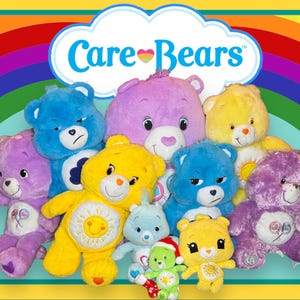 May include: A group of Care Bears plush toys in various colours, including purple, blue, yellow, and white. The Care Bears are arranged in a semi-circle with the Care Bears logo in a cloud above them. The Care Bears are all smiling and have different expressions on their faces.