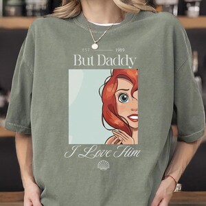 But Daddy I Love Him Comfort Colors Shirt for Disney Family Trip, Little Mermaid Ariel Comfort Colors Shirt, perfect for Magic Kingdom, Disney Princess Ariel Shirt, But Daddy I Love Him Quote Tee, Retro Disney Ariel T-Shirt, But Daddy I Love Him Design, Magic Kingdom Trip Shirt featuring Ariel and “But Daddy I Love Him”, Ariel Inspired Comfort Colors Shirt for Disney Family Vacation