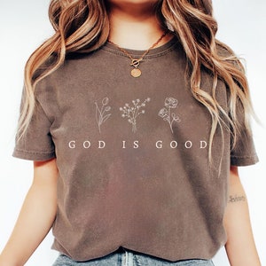 Faith based God is Good sweatshirt, inspirational Christian apparel with minimalist floral design for religious women and men.