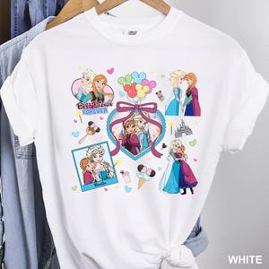 Cute coquette-style Disney Frozen shirt featuring Elsa and Anna with hearts, bows, and pastel icons, ideal for sisters and best friends.