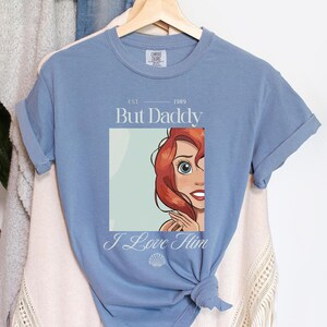 But Daddy I Love Him Comfort Colors Shirt for Disney Family Trip, Little Mermaid Ariel Comfort Colors Shirt, perfect for Magic Kingdom, Disney Princess Ariel Shirt, But Daddy I Love Him Quote Tee, Retro Disney Ariel T-Shirt, But Daddy I Love Him Design, Magic Kingdom Trip Shirt featuring Ariel and “But Daddy I Love Him”, Ariel Inspired Comfort Colors Shirt for Disney Family Vacation