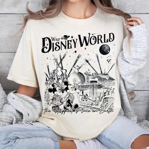 Retro Walt Disney World shirt with vintage-style illustrations of Magic Kingdom, Epcot, Hollywood Studios, and Animal Kingdom featuring classic Disney icons and park landmarks in a nostalgic line-art design.
