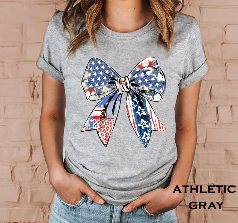 Distressed patriotic bow graphic in red white and blue with stars stripes and mixed animal print patterns perfect for USA 4th of July shirts women’s Independence Day tees America flag summer outfits cute freedom celebration apparel or red white blue patriotic shirt for parades BBQs and holiday events