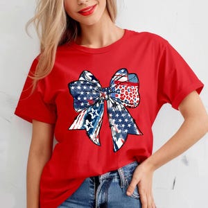 Patriotic bow shirt design with red white and blue colors stars and stripes perfect for 4th of July womens Independence Day summer outfit