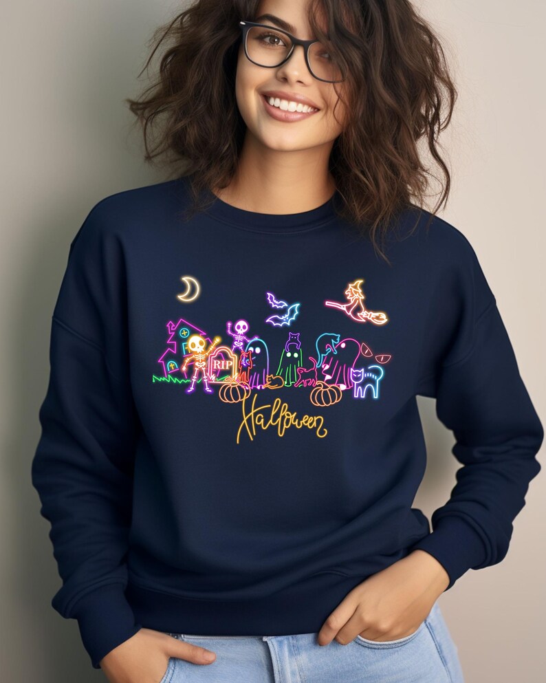 Spooky neon Halloween shirt with glow-in the dark designs of skeletons, ghosts, and a flying witch, great for Halloween parties and festive outings.