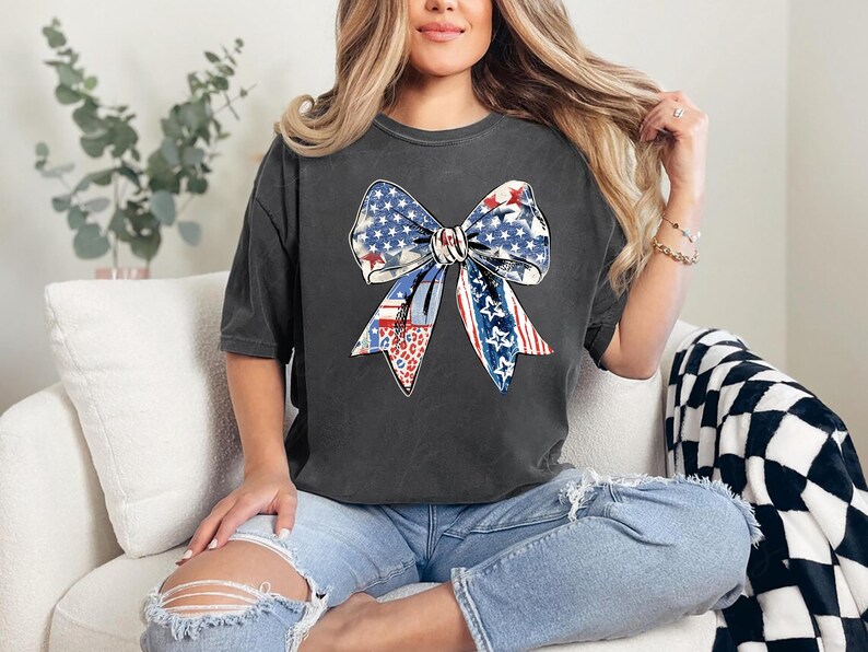 Distressed patriotic bow graphic in red white and blue with stars stripes and mixed animal print patterns perfect for USA 4th of July shirts women’s Independence Day tees America flag summer outfits cute freedom celebration apparel or red white blue patriotic shirt for parades BBQs and holiday events