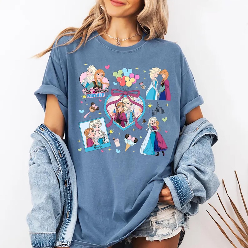 Cute coquette-style Disney Frozen shirt featuring Elsa and Anna with hearts, bows, and pastel icons, ideal for sisters and best friends.