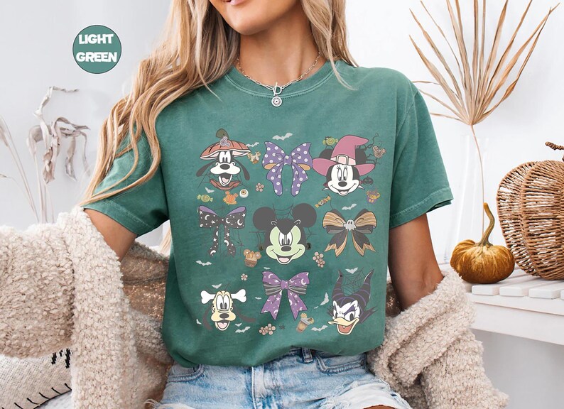 Pastel Disney Halloween shirt design featuring Mickey, Minnie, Donald, Goofy, and bows in coquette style with spider webs, candy, and spooky accents—perfect for family matching shirts and Mickey’s Not So Scary Halloween Party 2025.
