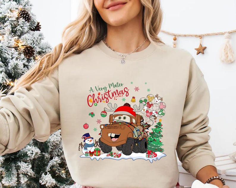 A Very Mater Christmas design featuring Mater with reindeer antlers, Christmas tree, and snowman, ideal for Disney Cars fans and holiday fun.