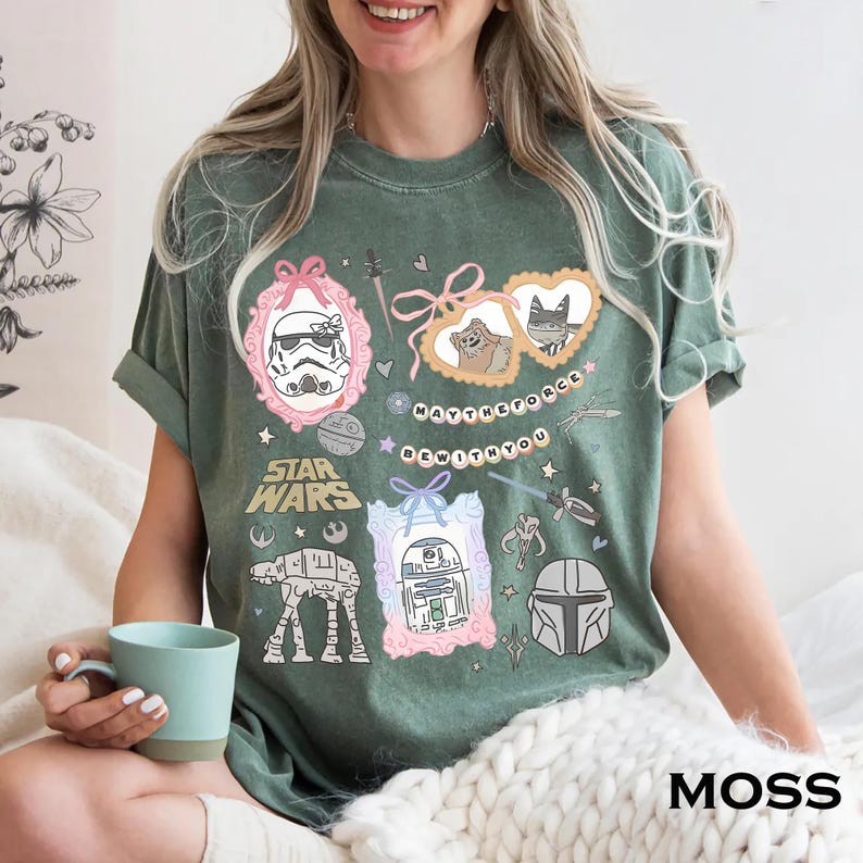 Retro pastel water color coquette Star Wars shirt with kawaii-style Stormtrooper, R2D2, AT-AT, Ewok, and Mandalorian helmet in watercolor frames with bows and hearts, perfect for Disney trip or Star Wars Day outfit.