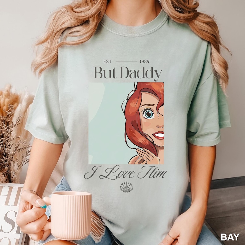 But Daddy I Love Him Comfort Colors Shirt for Disney Family Trip, Little Mermaid Ariel Comfort Colors Shirt, perfect for Magic Kingdom, Disney Princess Ariel Shirt, But Daddy I Love Him Quote Tee, Retro Disney Ariel T-Shirt, But Daddy I Love Him Design, Magic Kingdom Trip Shirt featuring Ariel and “But Daddy I Love Him”, Ariel Inspired Comfort Colors Shirt for Disney Family Vacation