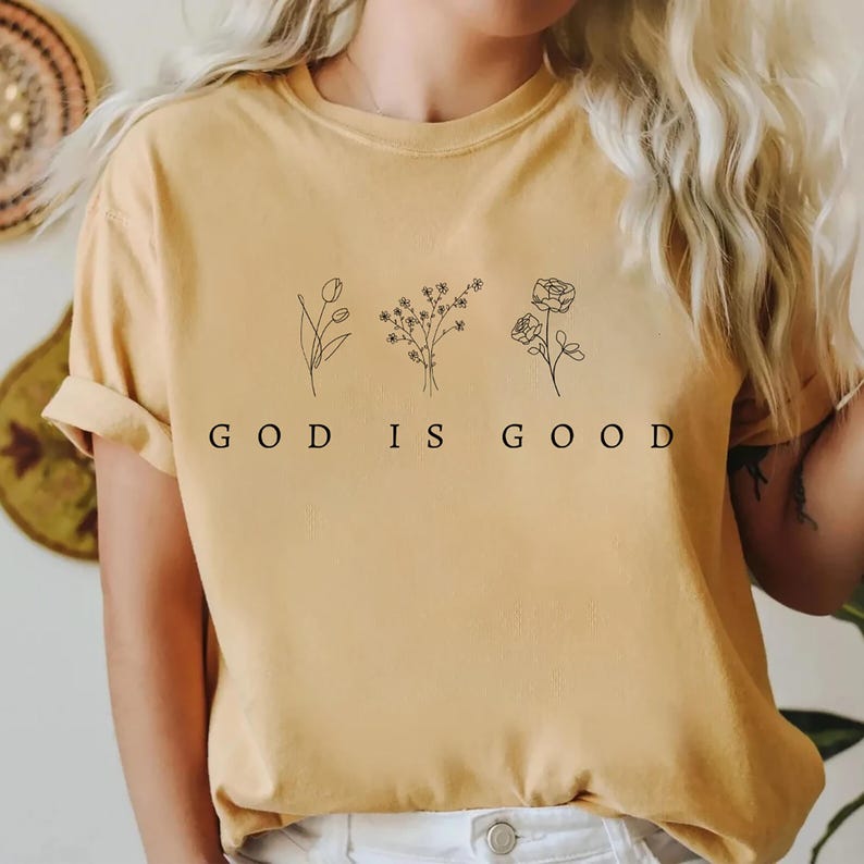 Comfortable and trendy Christian sweatshirt with God is Good print, faith-inspired design for church groups or faith-based organizations.