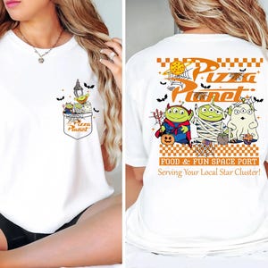 Toy Story Pizza Planet Halloween shirt front design with three green aliens dressed as devil mummy and ghost holding candy, featuring vintage Disney Halloween style for Not So Scary Party or Disneyland trip. Pizza Planet Halloween claw machine pocket design on the back of shirt with Toy Story aliens in costumes and spooky spiderweb, perfect for Disney family matching Halloween outfit and Mickey’s Not So Scary event.
